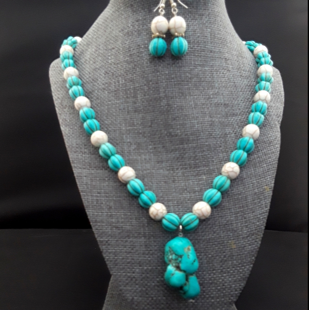 Stone necklace and earring set .